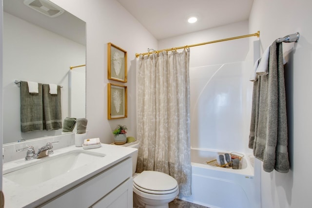 full bathroom with vanity, shower / bath combo, and toilet