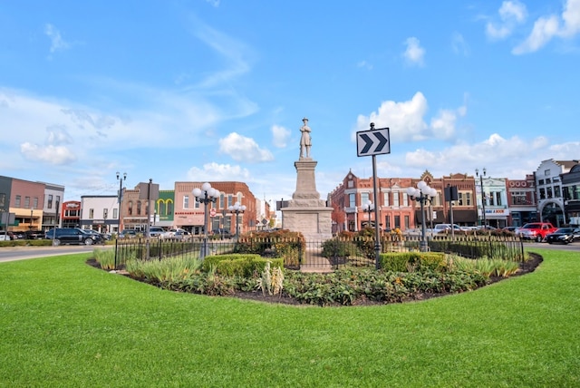 view of home's community featuring a lawn