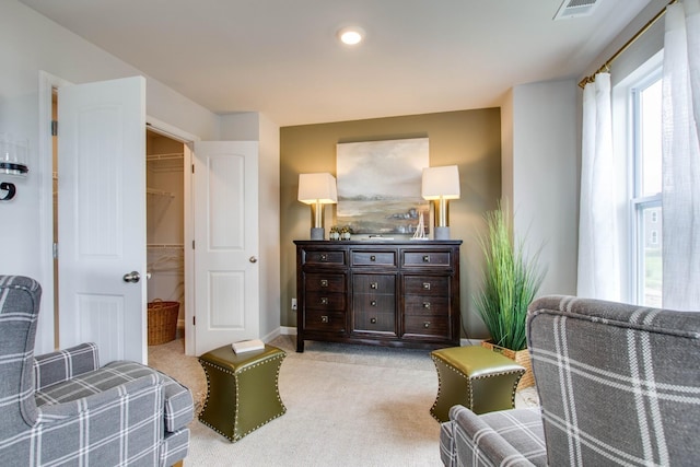 living area featuring light colored carpet