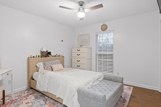 bedroom with ceiling fan and wood-type flooring