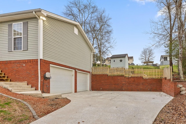 view of side of home with a garage