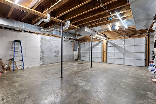 garage featuring electric panel and a garage door opener