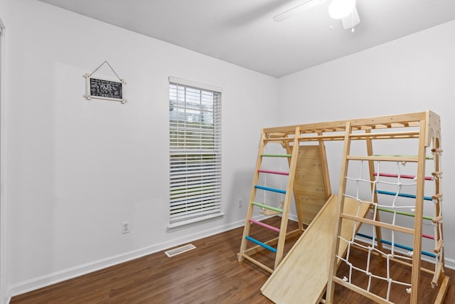 bedroom with ceiling fan and hardwood / wood-style flooring