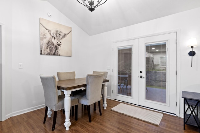 dining room with french doors, dark hardwood / wood-style floors, and lofted ceiling