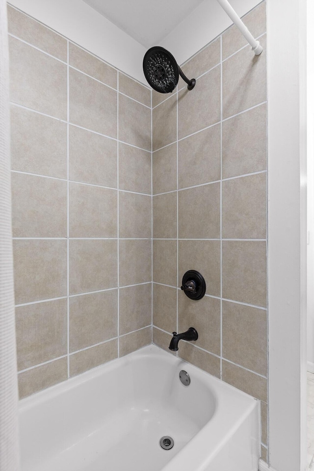 bathroom with shower / tub combo