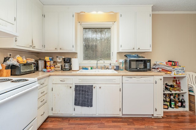 kitchen featuring dark wood-type flooring, sink, white appliances, and white cabinets