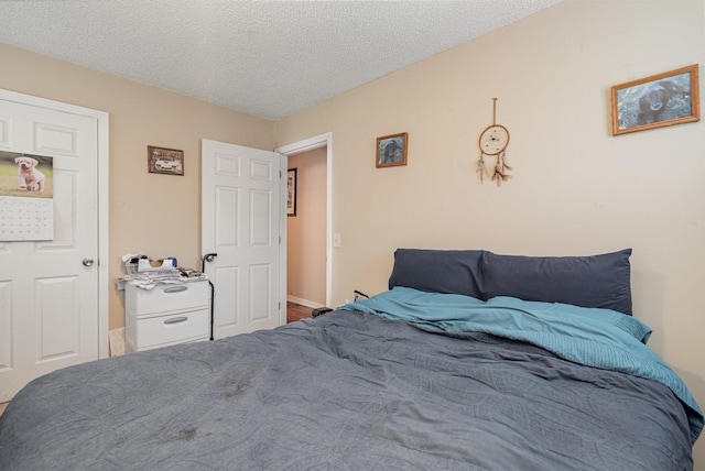 bedroom featuring a textured ceiling