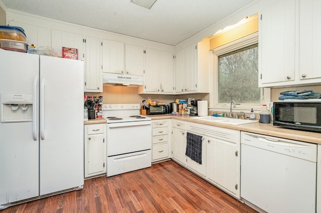 kitchen featuring white cabinetry, sink, white appliances, and a textured ceiling