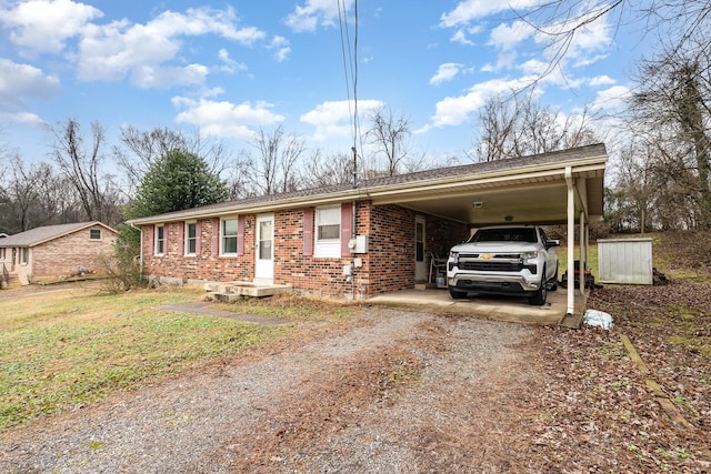 ranch-style house featuring a carport