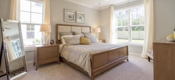 bedroom featuring light carpet and ornamental molding