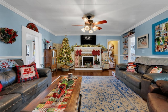 living room featuring ceiling fan, dark hardwood / wood-style flooring, and ornamental molding