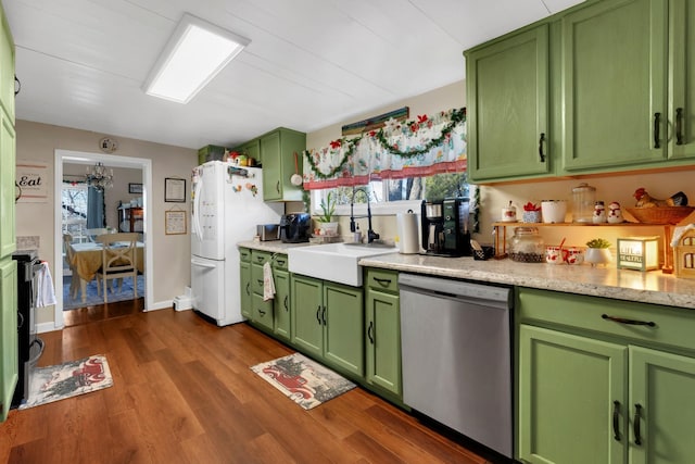 kitchen with dishwasher, green cabinets, and sink