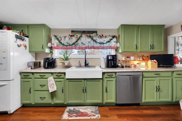 kitchen with dark hardwood / wood-style flooring, sink, green cabinetry, dishwasher, and white fridge