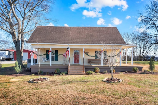 bungalow featuring central AC, a front lawn, and a porch