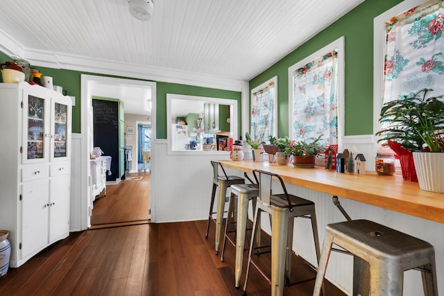 kitchen with dark hardwood / wood-style flooring, wooden counters, and white refrigerator