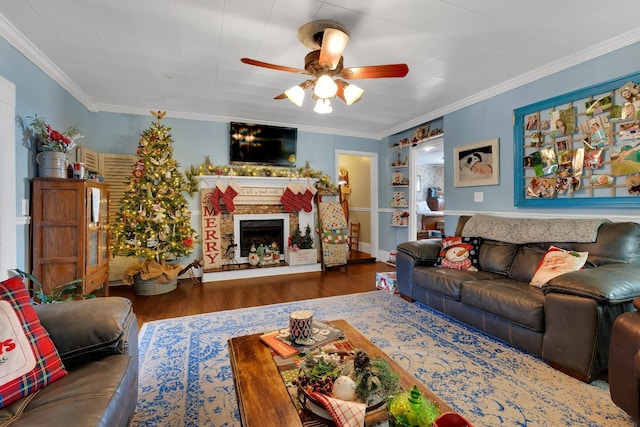 living room with crown molding, ceiling fan, and dark hardwood / wood-style floors