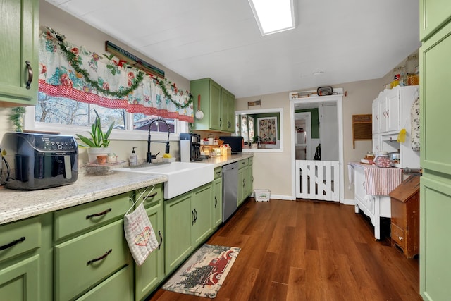 kitchen with dishwasher, dark hardwood / wood-style flooring, green cabinetry, and sink