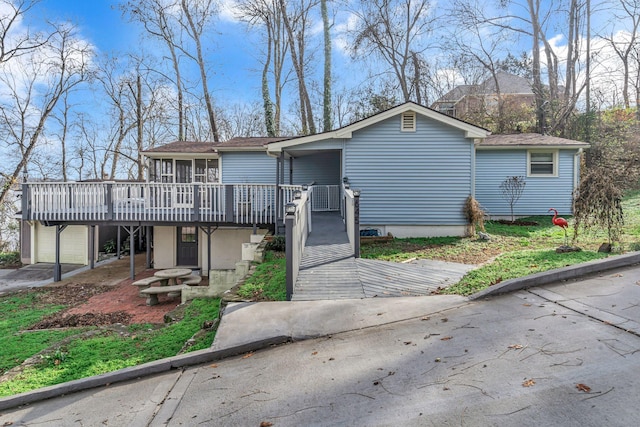 view of front of property with a wooden deck