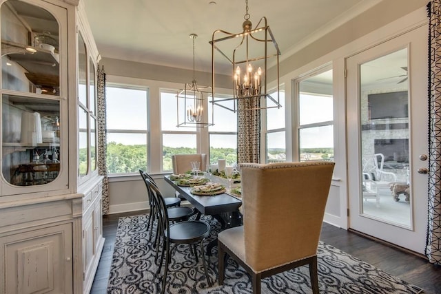 dining room featuring a chandelier, dark hardwood / wood-style floors, and crown molding