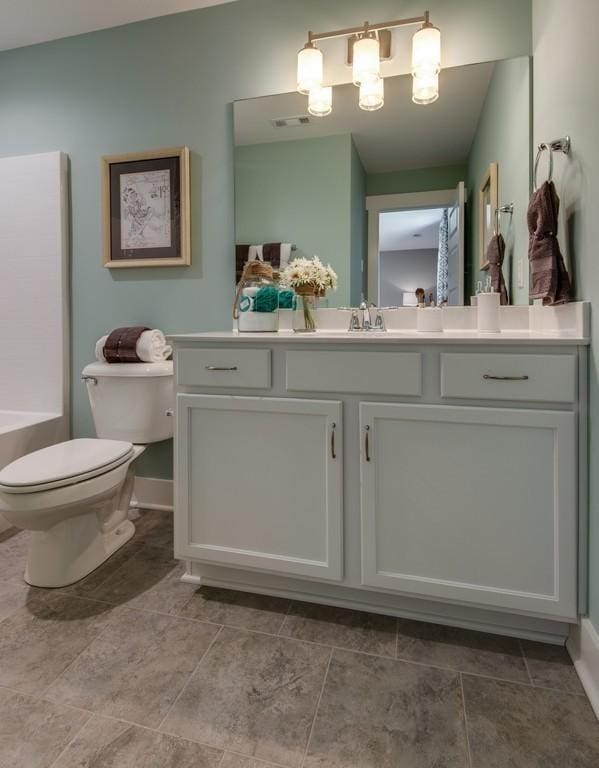 bathroom with vanity and toilet