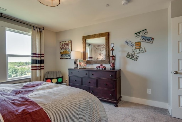 bedroom featuring light colored carpet