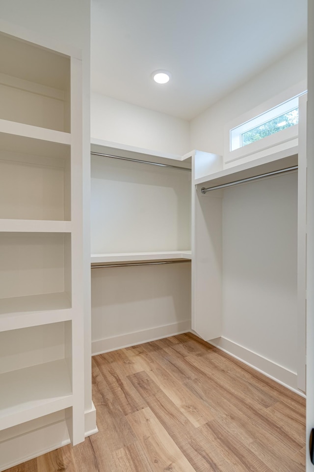 walk in closet featuring wood-type flooring