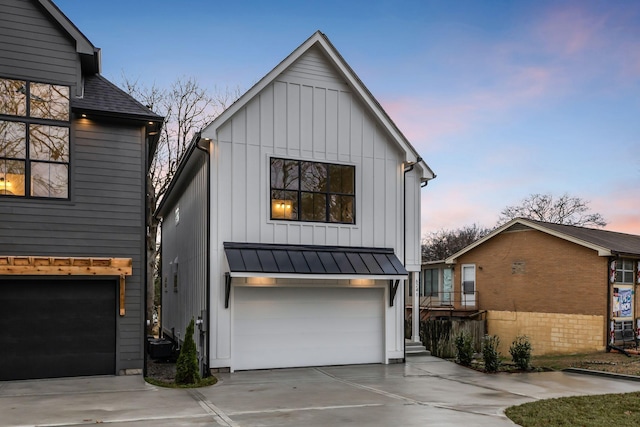 modern inspired farmhouse featuring a garage