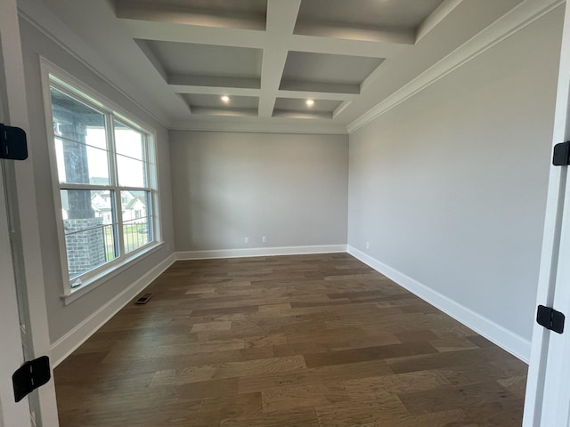 spare room with beam ceiling, crown molding, dark wood-type flooring, and coffered ceiling