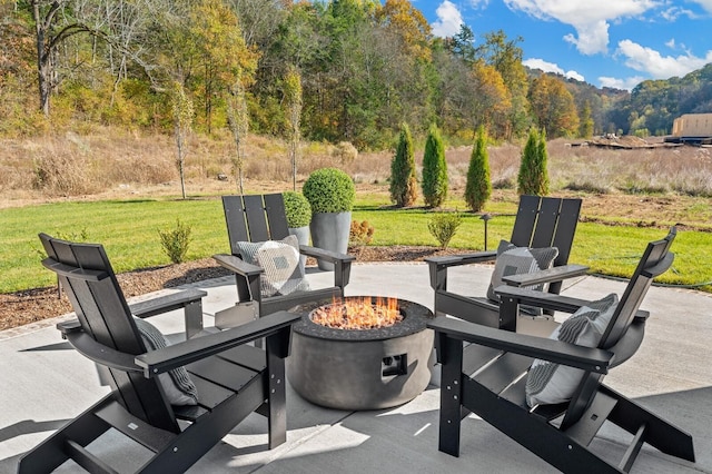 view of patio / terrace with a fire pit