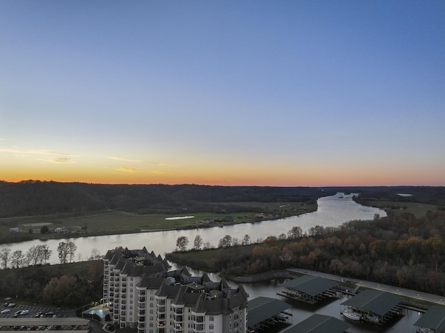 aerial view at dusk with a water view