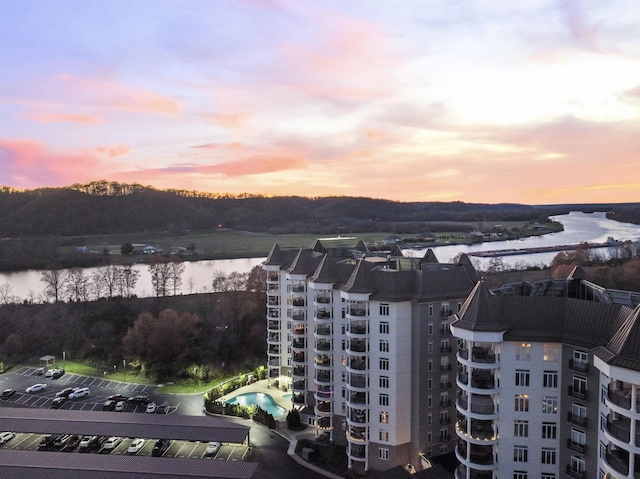 aerial view at dusk with a water view