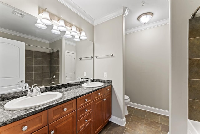 bathroom with tile patterned floors, vanity, toilet, and crown molding