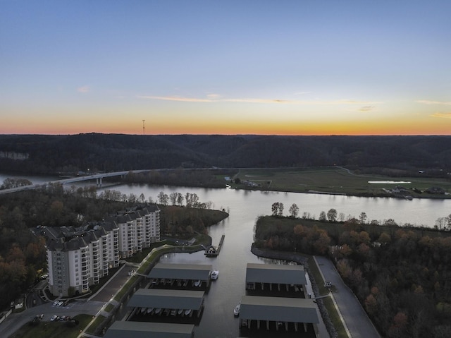 aerial view at dusk with a water view