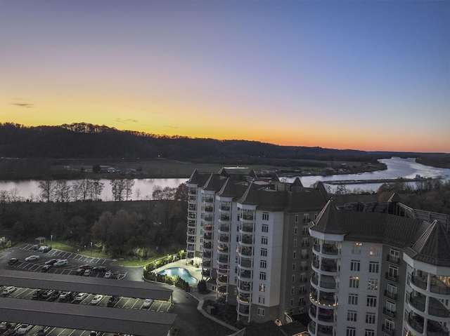 aerial view at dusk with a water view