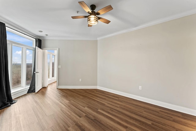 empty room with hardwood / wood-style flooring, ceiling fan, and ornamental molding