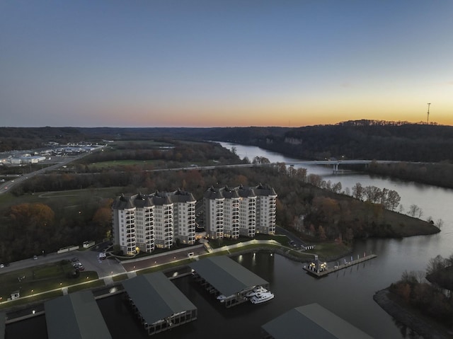 aerial view at dusk with a water view