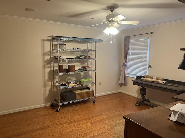 office area with hardwood / wood-style flooring, ceiling fan, and ornamental molding