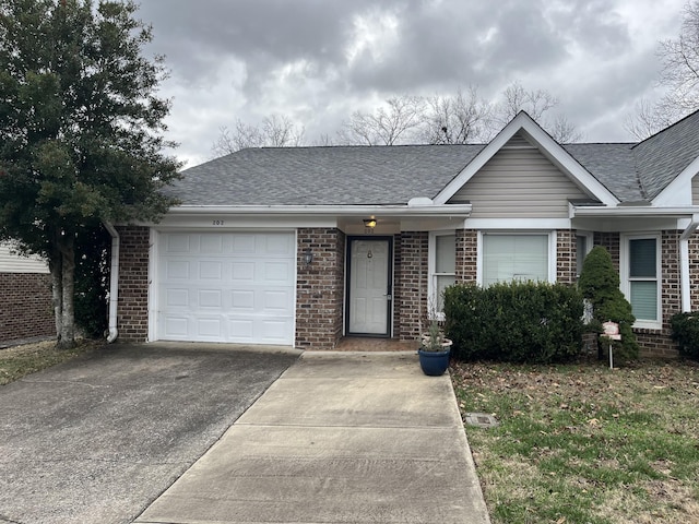 single story home featuring a garage