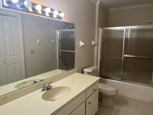 full bathroom featuring vanity, shower / bath combination with glass door, tile patterned floors, toilet, and ornamental molding