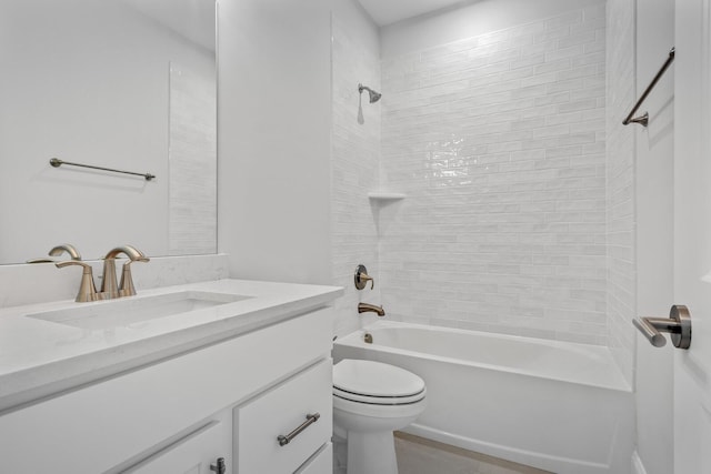 full bathroom featuring vanity, toilet, and tiled shower / bath