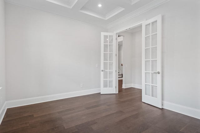 spare room with coffered ceiling, french doors, dark hardwood / wood-style floors, ornamental molding, and beam ceiling