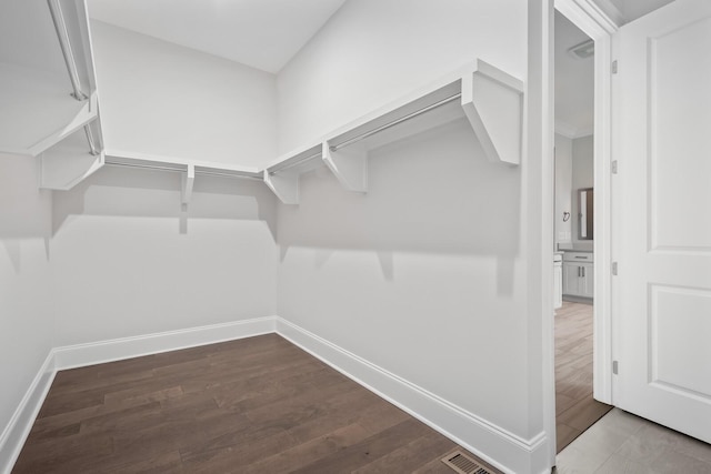 spacious closet featuring hardwood / wood-style floors