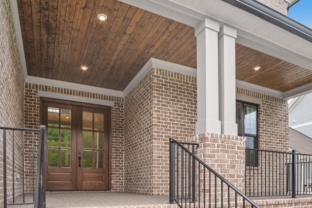 property entrance featuring french doors