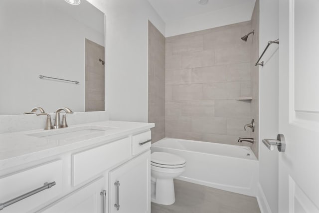 full bathroom featuring toilet, vanity, and tiled shower / bath combo