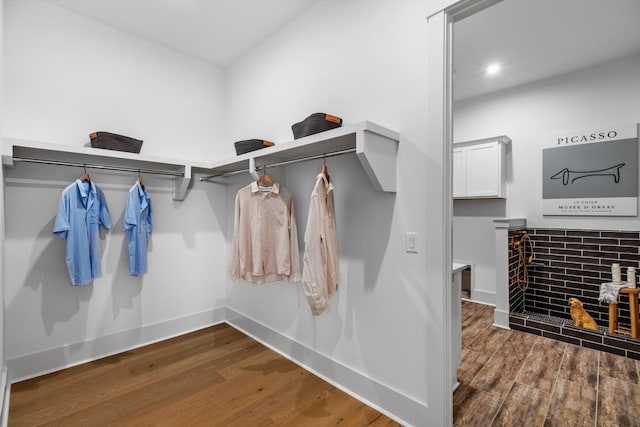 spacious closet with dark hardwood / wood-style floors