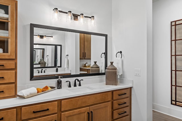 bathroom with hardwood / wood-style floors and vanity