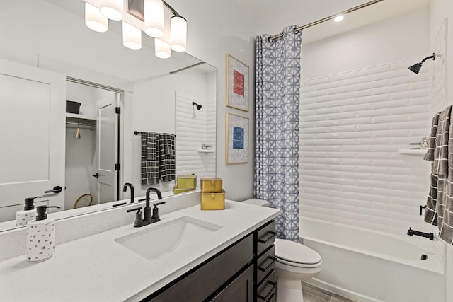 full bathroom featuring vanity, toilet, and shower / tub combo with curtain