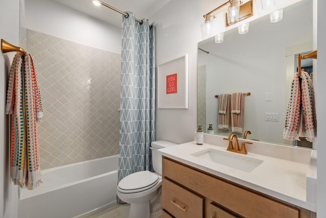 full bathroom with vanity, shower / bath combo, and toilet