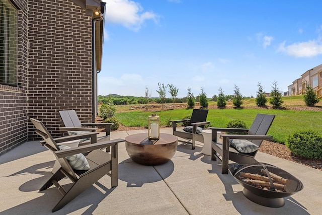 view of patio / terrace featuring a fire pit