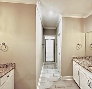 bathroom featuring vanity, tile patterned floors, and crown molding